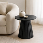 Flint Side Table styled beside a sofa