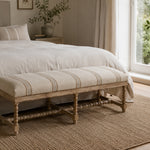 Bobbin Ottoman in Stripe styled in a living room